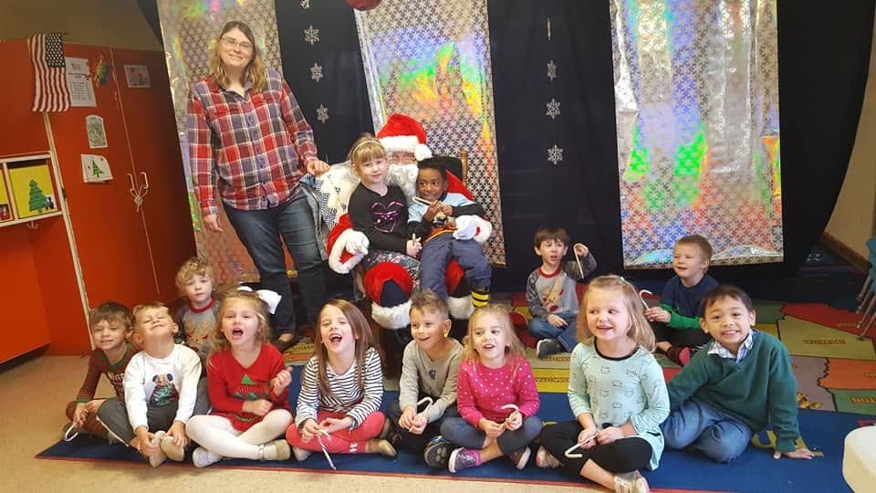 Children and staff celebrating together at Village Childcare